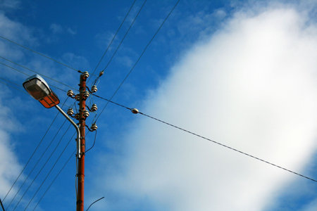 Lamppost and cloudy skies