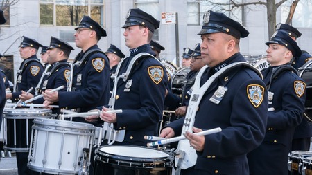 NEW YORK - MARCH 17, 2016: Drummers from Police  marching at the St. Patrick's Day Parade in New York.のeditorial素材