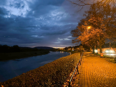 Golden autumn on the embankment at night in the light of lanternsの写真素材