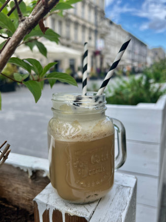 Iced cappuccino coffee in a mason jar with strawsの写真素材