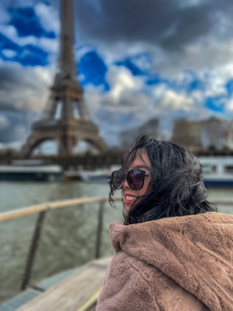 Beautiful young woman in Paris, near the Eiffel tower