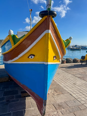 Colorful fishing boat in Marsaxlokk harbor, Maltaの写真素材