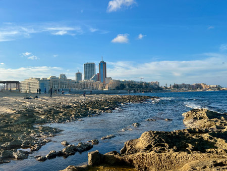Rocky seashore with blue sea and sky at Sliema, Malta. Natural backgroundの写真素材