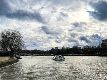 View of the river in Paris, France. Cloudy day.