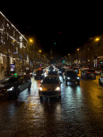 Heavy rain in the Paris street at night lights. View from the sightseeing excursion busの写真素材