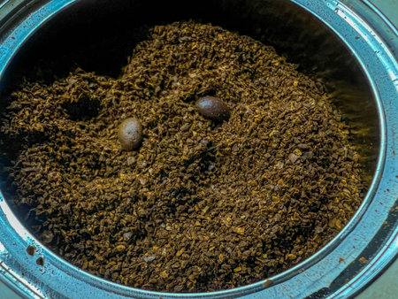 Coffee beans and ground coffee on a brown background. Coffee background.