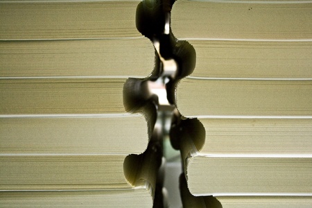 Two stacks of books are on the tableの写真素材