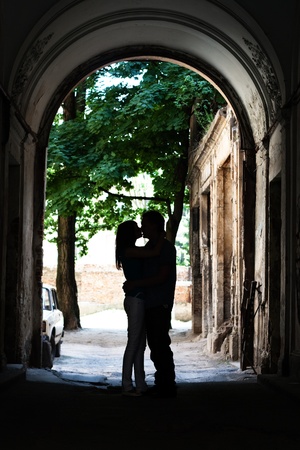 Love young couple kissing in the yardの写真素材