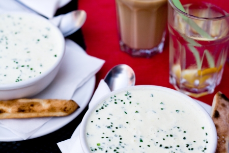 Flavored cheese soup with greens for dinnerの写真素材