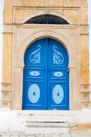 Blue doors and white wall of building in Sidi Bou Said, Tunisiaのeditorial素材