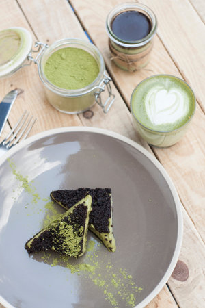 Cup of Matcha Green Tea and Cake and ice cream with green matchaの写真素材