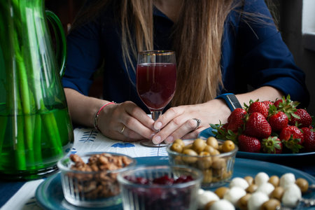 A gourmet break: a plate of strawberries, small bowls of cranberries, olives and walnuts, mozzarella...