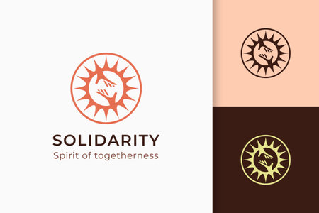 Charity or donation logo in hand and sun represent peace or solidarityのイラスト素材