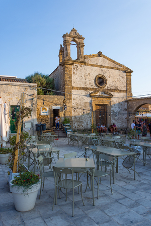 MARZAMEMI, ITALY - AUGUST 19, 2017: The old church of San Francesco di Paola in the main square of Marzamemi, where we find several places, a favorite destination for tourists.のeditorial素材