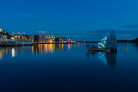 Exterior night view of the city and the glass structure art in the middle of the bay, located in Oslo, Norwayのeditorial素材