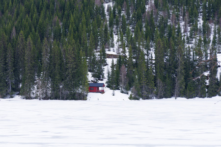 Red house in the snowy forest, Norwayの写真素材