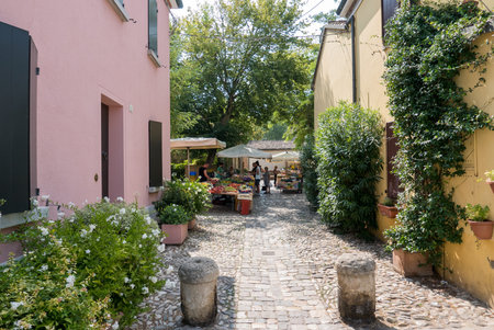 CESENATICO - 7 AUGUST 2018: group of colored houses in the old square with masonry basins originally...