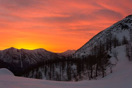 Snowy panorama of the Val Bognanco that opens behind Domodossola at the dawn, Piedmont, Italyの写真素材