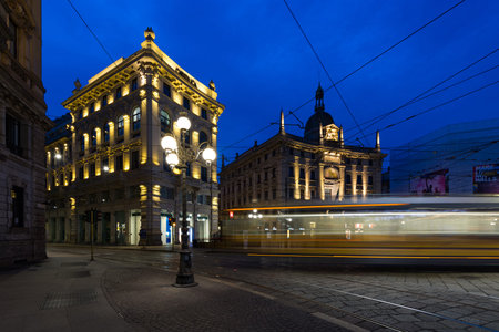 Milan, Italy - March 18, 2017: Palazzo delle Assicurazioni Generali in Piazza Cordusio at dusk, in...