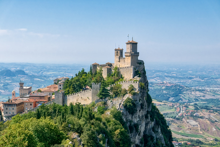 Guaita tower in the fortifications of San Marino on Monte Titano, with the City of San Marino on the left.のeditorial素材