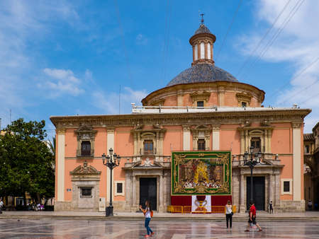 Valencia, Spain: June 13, 2015 - Tourists stroll in front of the Basilica of the Virgin of the Abandonedのeditorial素材