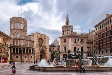 Valencia, Spain: June 13, 2015 - Turia Fountain, in the background the Valencia Cathedral