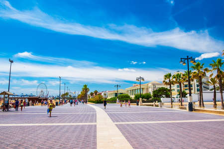 Valencia, Spain: June 14, 2015 - Tourists and locals stroll the Valencia waterfront on a beautiful summer dayのeditorial素材