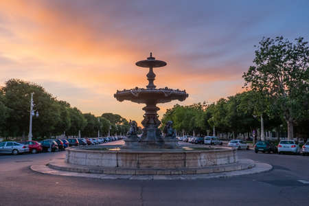 Valencia, Spain: June 14, 2015 - Fountain illuminated with the colors of the sunset after the rain in Valenciaのeditorial素材