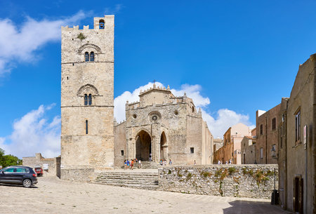 ERICE, ITALY - AUGUST 27, 2012: Tourists visit the Cathedral of Erice and the bell tower of the Cathedral of the Assumption, Erice, Trapaniのeditorial素材