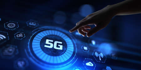 5G Fifth generation high-speed wireless internet connection telecommunication concept. Hand pressing button on screenの写真素材
