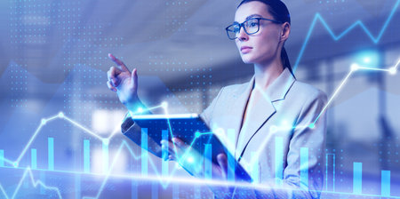 Chart graphs diagram business financial data analytics. Woman using augmented reality virtual screen.の写真素材