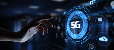 5G Fifth generation high-speed wireless internet connection telecommunication concept. Hand pressing button on screen.の写真素材