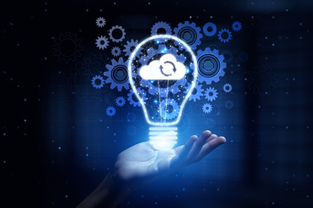 Cloud Computing Enabling Scalable Data Storage and Access with Human Hand Holding Lamp Hologram.