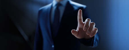 Businessman pressing button on virtual screen, Innovation and Digital Touch Interaction on Futuristic Technology Interface.の写真素材