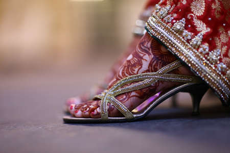 A perfect pick for brides who donât wish to opt for the usual diagonal  traditional foot henna designs.の写真素材