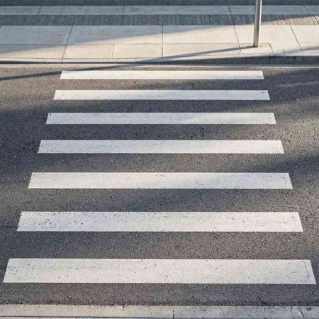 Zebra crossing on the road in the city, close-up