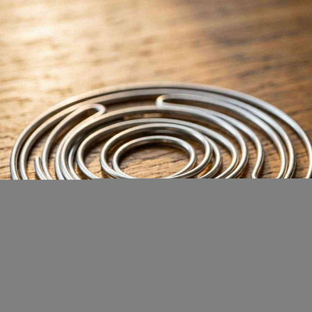 steel springs on a wooden background, close-up, selective focus