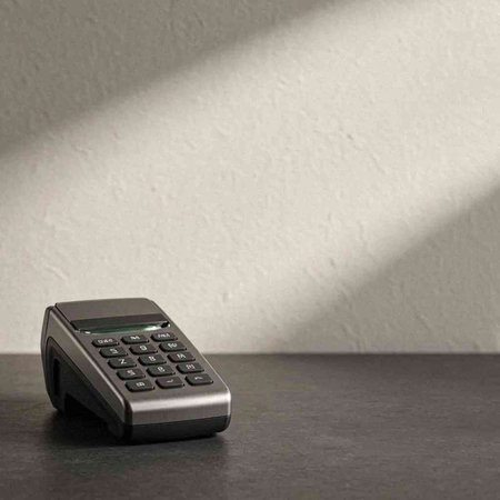calculator on the table with shadow from the wall. business concept