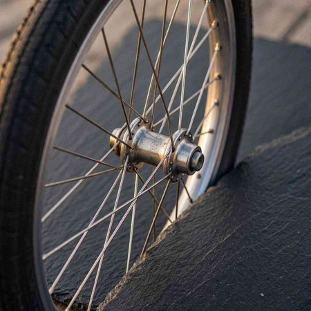 Bicycle wheel on the road, close-up of wheel.