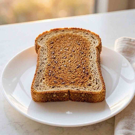 Sliced toast bread on a white plate. Close-up.