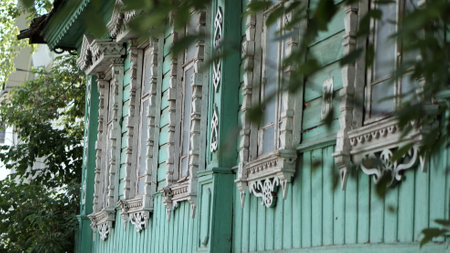 green wooden building and green foliageの写真素材