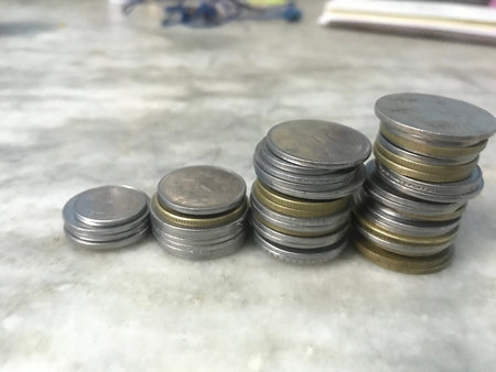 Value of Indian currency gradually increases in terms of Coins of Indian currency which are stacked...