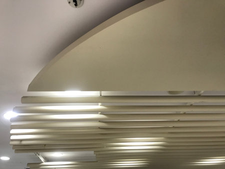 Different designs of Gypsum false ceiling with Epoxy coated MS pipes fixed for decoration of an...