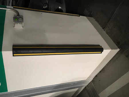 L Shaped Synthetic Heavy duty column corner rubber guards are fixed in each corner of column in car parking basement where vehicles may hit or damage the Columns or pillarsの写真素材