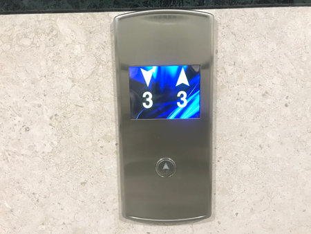 Chrome plated or stainless steel finished Floor indicator panel fixed on a granite finished wall...