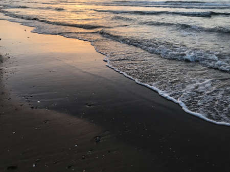 Evening Sunset at the beach muscat with background of running waves of ocean towards oman peninsulaのeditorial素材