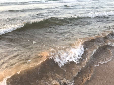 Evening Sunset at the beach muscat with background of running waves of ocean towards oman peninsulaのeditorial素材