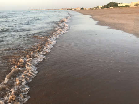 Evening Sunset at the beach muscat with background of running waves of ocean towards oman peninsulaのeditorial素材