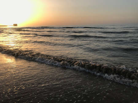 Evening Sunset at the beach muscat with background of running waves of ocean towards oman peninsulaのeditorial素材