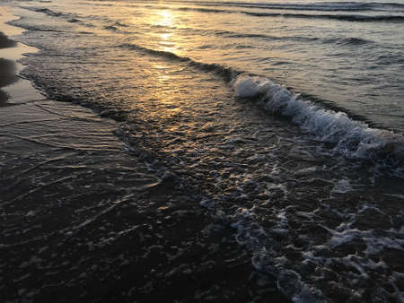 Evening Sunset at the beach muscat with background of running waves of ocean towards oman peninsulaのeditorial素材